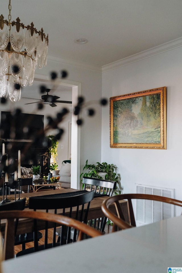 dining area with visible vents, ceiling fan, and crown molding