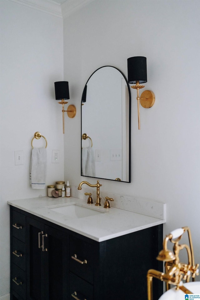 bathroom with vanity and ornamental molding