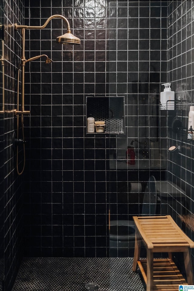 bathroom with a tile shower