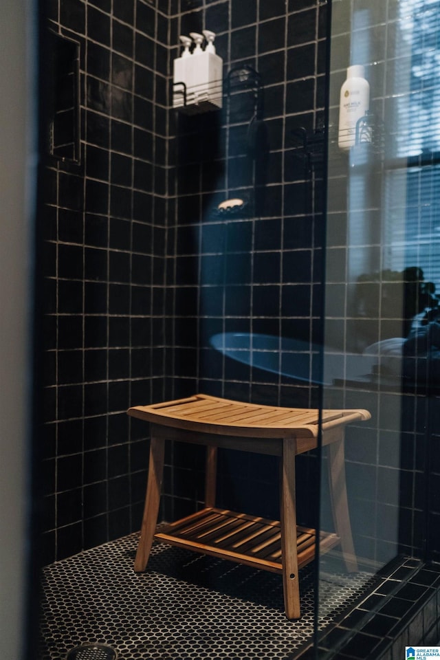 bathroom with a tile shower