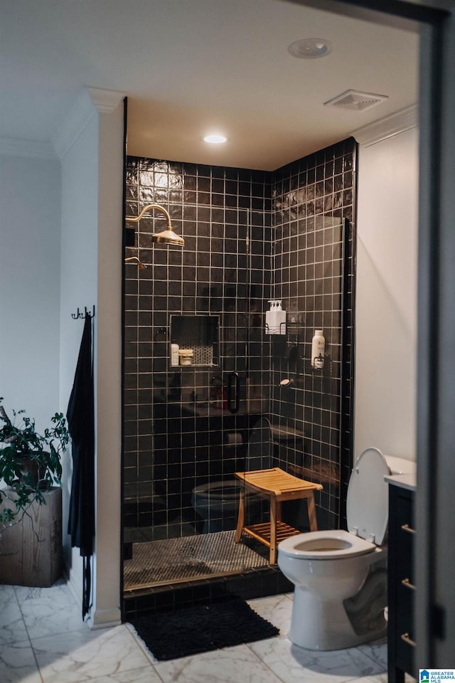full bathroom featuring marble finish floor, a stall shower, toilet, and ornamental molding