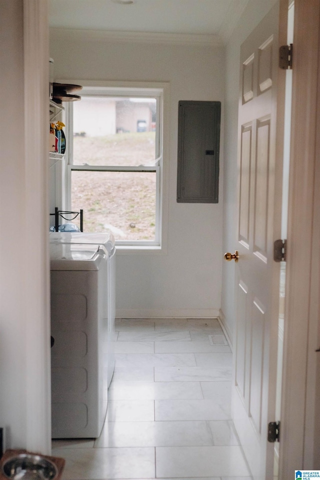 clothes washing area with baseboards, laundry area, electric panel, crown molding, and washer and clothes dryer
