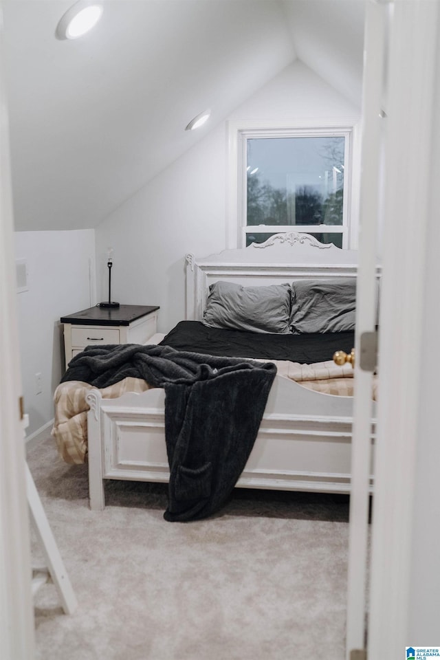 carpeted bedroom featuring recessed lighting and lofted ceiling