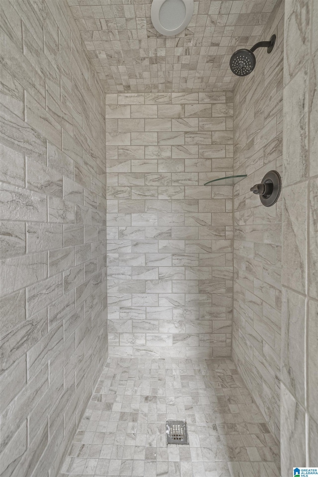 bathroom with tiled shower