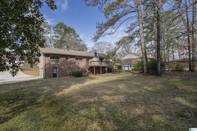 exterior space with stairs, a deck, central AC unit, and fence