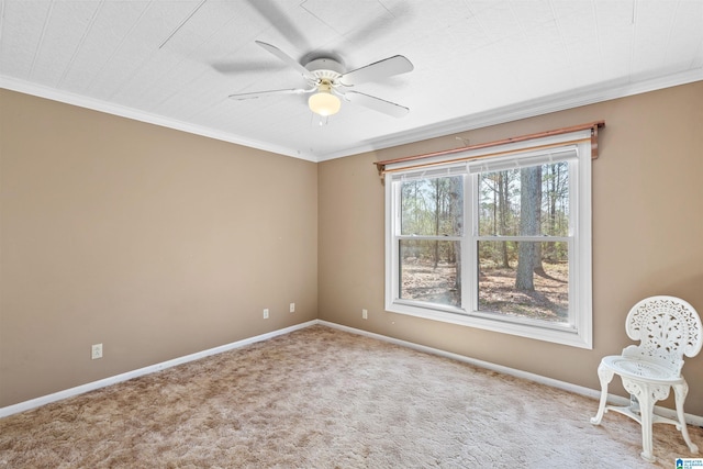 interior space featuring baseboards, a ceiling fan, and crown molding