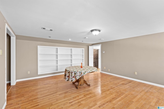 interior space with visible vents, baseboards, and light wood-type flooring