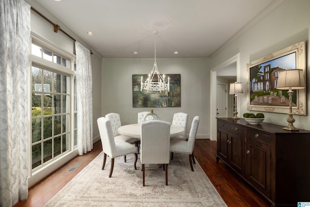 dining room featuring recessed lighting, visible vents, a notable chandelier, and wood finished floors