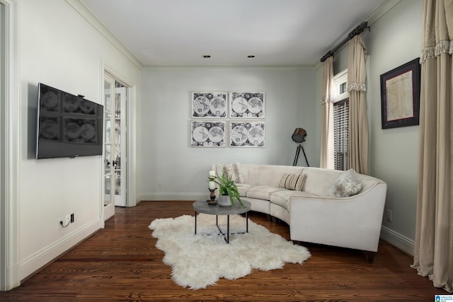 living area featuring baseboards and dark wood finished floors