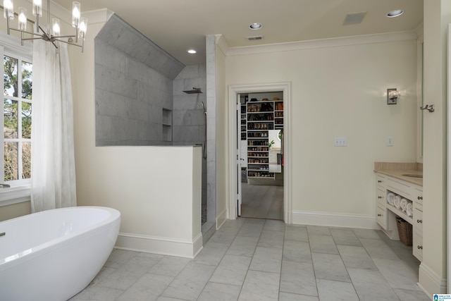 bathroom featuring a walk in closet, crown molding, and a tile shower