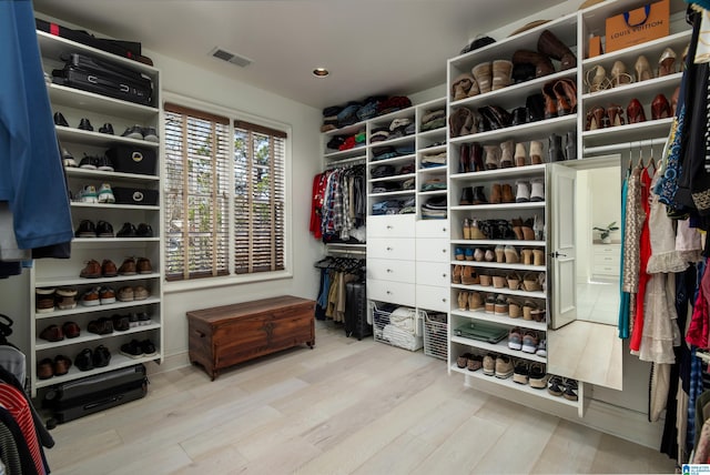 spacious closet with visible vents and wood finished floors