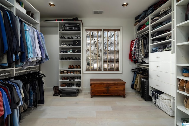 spacious closet featuring visible vents