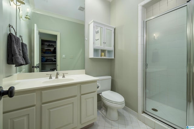 bathroom with tile patterned flooring, visible vents, toilet, a stall shower, and vanity