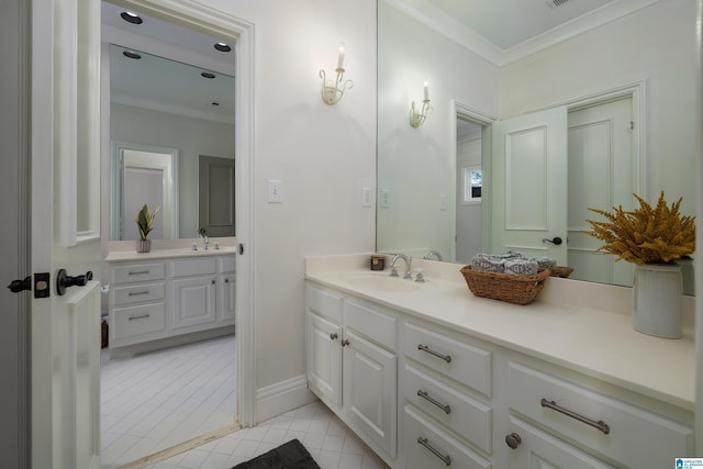 bathroom featuring tile patterned floors, ornamental molding, and vanity