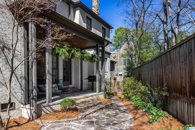 view of side of property with a fenced backyard