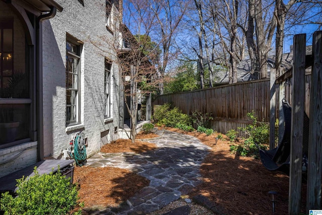 view of yard with a fenced backyard and a patio area