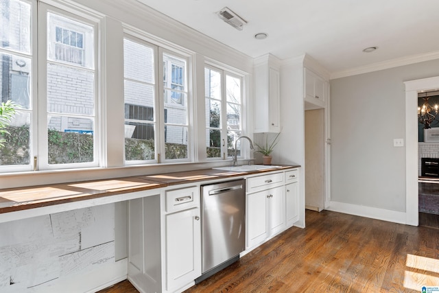 kitchen featuring a sink, stainless steel dishwasher, a healthy amount of sunlight, and crown molding