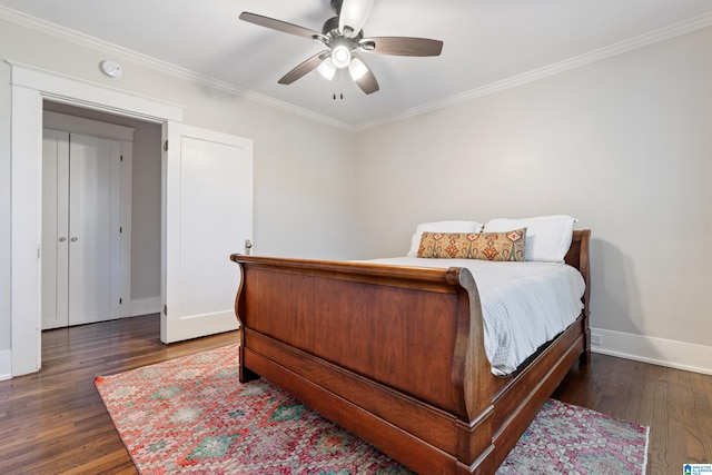 bedroom with baseboards, wood finished floors, and crown molding