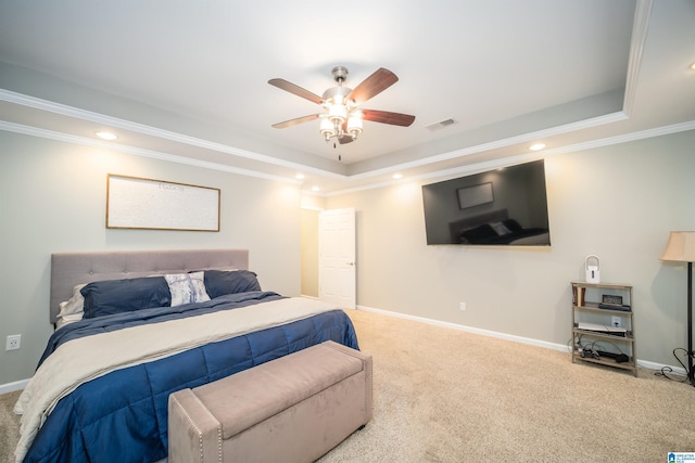 bedroom with visible vents, carpet floors, and a raised ceiling