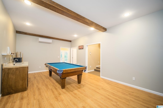 game room featuring baseboards, a wall mounted AC, beam ceiling, light wood-style flooring, and recessed lighting