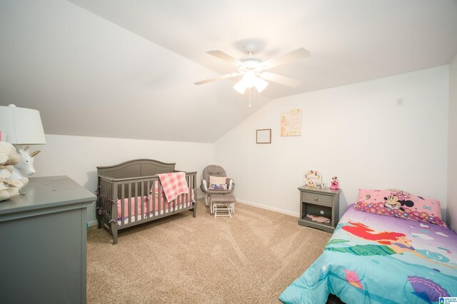 bedroom featuring baseboards, a ceiling fan, carpet flooring, and vaulted ceiling