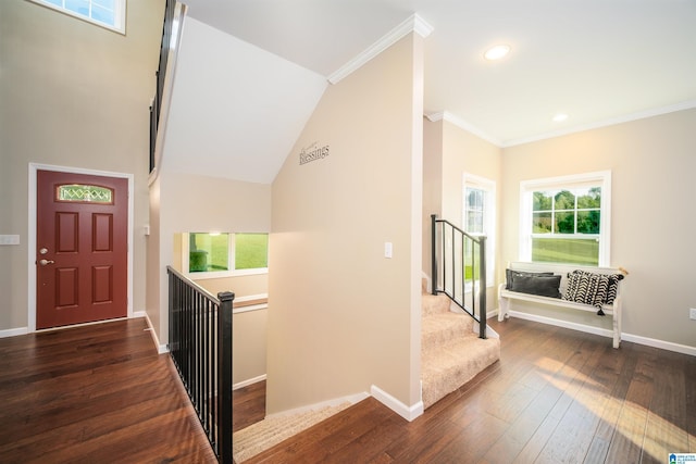 foyer featuring recessed lighting, baseboards, dark wood finished floors, and ornamental molding