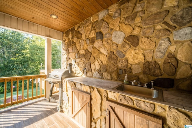 wooden terrace with a sink