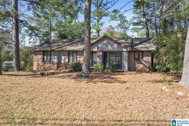 view of front of home with brick siding