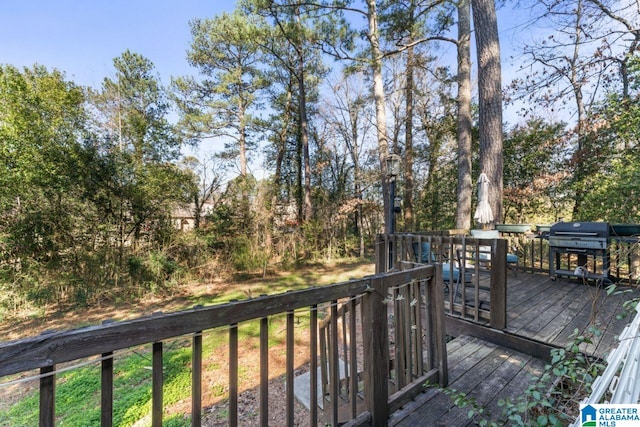 wooden deck featuring grilling area