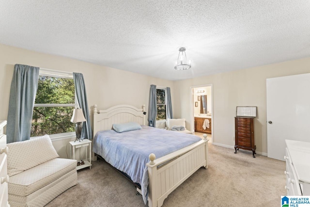 bedroom featuring a textured ceiling, ensuite bath, an inviting chandelier, baseboards, and light colored carpet