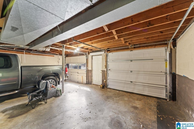 garage with concrete block wall