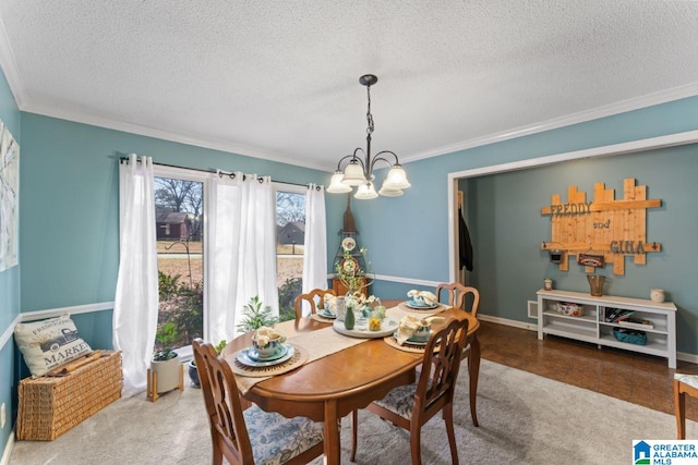 dining area with a notable chandelier, a textured ceiling, baseboards, and ornamental molding