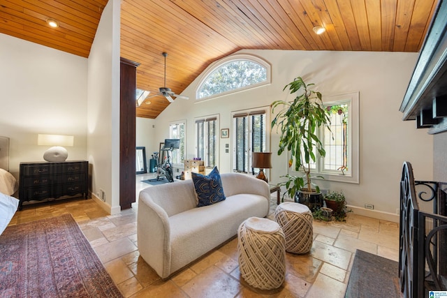 living room featuring stone tile flooring, wooden ceiling, high vaulted ceiling, and baseboards