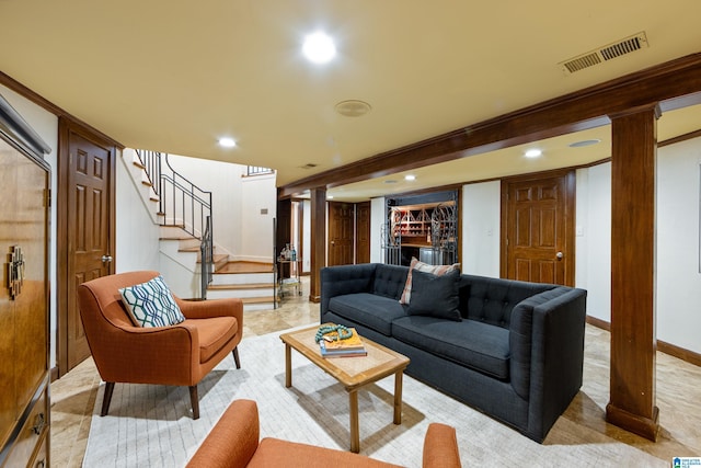 living room featuring recessed lighting, visible vents, stairway, and decorative columns