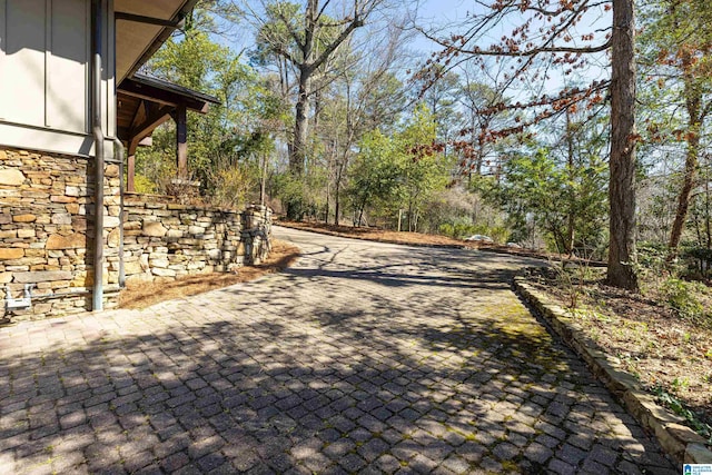 exterior space featuring decorative driveway