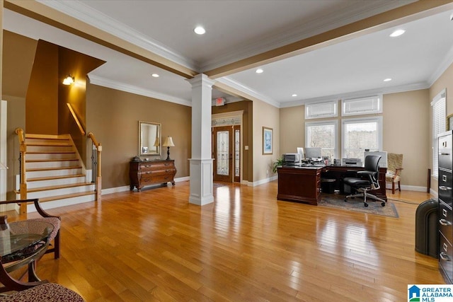 office featuring light wood-style flooring, decorative columns, baseboards, and ornamental molding