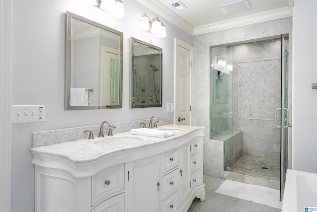 bathroom featuring visible vents, a stall shower, crown molding, and a sink