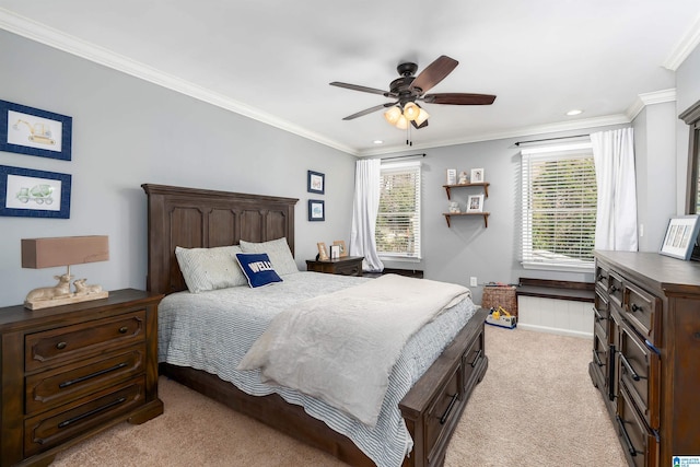 bedroom with multiple windows, light colored carpet, a ceiling fan, and ornamental molding