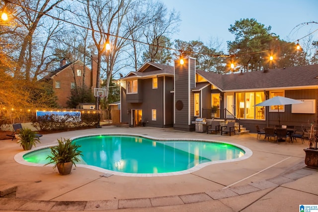 outdoor pool featuring a patio area