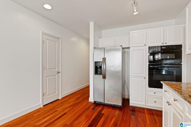 kitchen with baseboards, stainless steel fridge with ice dispenser, dark wood-style floors, white cabinetry, and dobule oven black