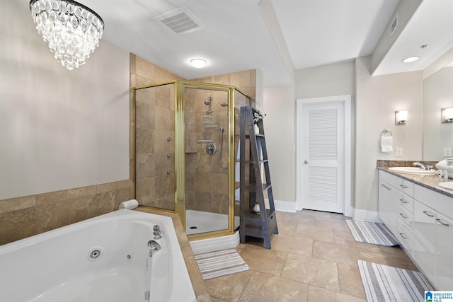 bathroom with a shower stall, double vanity, visible vents, and a whirlpool tub