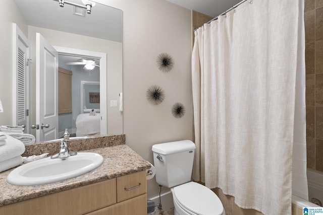 full bath with visible vents, toilet, shower / tub combo with curtain, vanity, and a ceiling fan