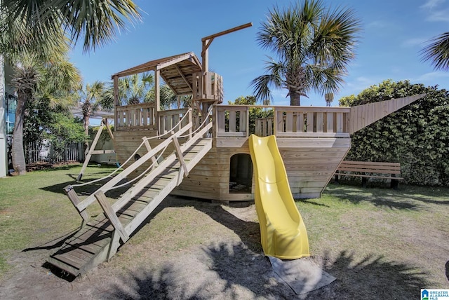 view of playground with a lawn