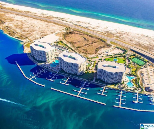 bird's eye view featuring a view of the beach and a water view