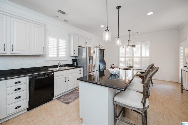 kitchen with visible vents, ornamental molding, a sink, stainless steel fridge, and dishwasher