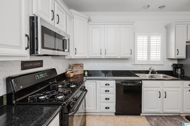 kitchen with a sink, decorative backsplash, black appliances, and white cabinets