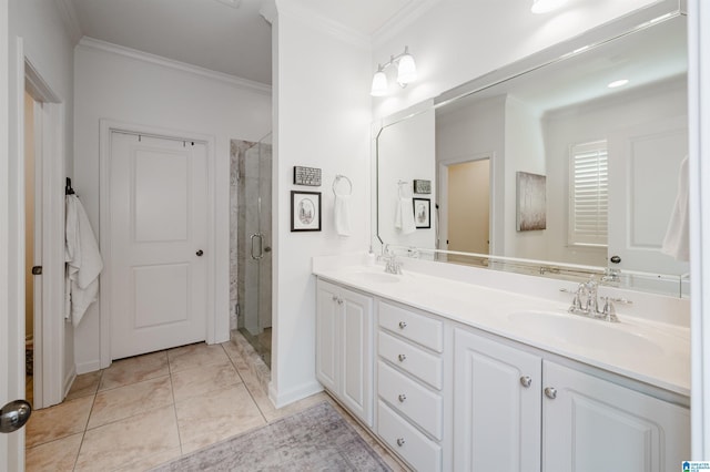 bathroom featuring double vanity, a shower stall, crown molding, and a sink