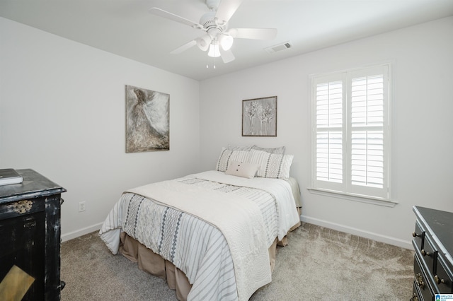 bedroom featuring visible vents, a ceiling fan, baseboards, and carpet floors