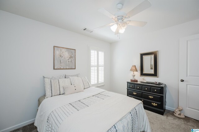 bedroom featuring a ceiling fan, carpet flooring, baseboards, and visible vents