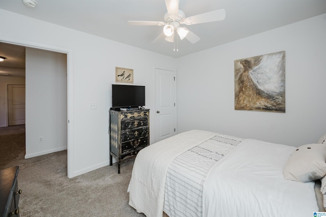 bedroom featuring light carpet, ceiling fan, and baseboards